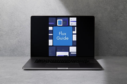 A dark gray laptop sits open on a light gray surface against a textured gray wall, displaying a digital guide titled 'Flux Guide' on its screen.