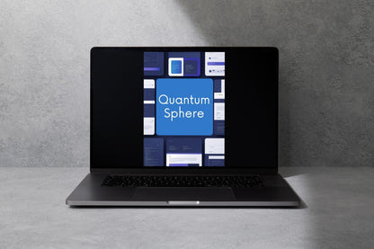 A dark gray laptop sits open on a light gray surface against a textured gray wall, with its screen displaying a blue and white interface labeled 'Quantum Sphere'.